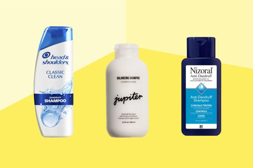 Image of three dandruff-fighting shampoo bottles on a light yellow background. From left to right: Head & Shoulders Classic Clean, Jupiter Balancing Shampoo, and Nizoral Anti-Dandruff Shampoo.