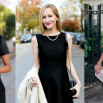 Three women in black dresses pose outdoors. The first adjusts her hair, the second holds a white coat, and the third touches an earring while holding a clutch. Their elegant black dresses stand out amidst blurred greenery and urban buildings behind them.