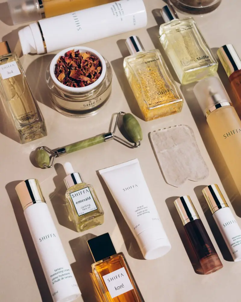 A vibrant display of summer beauty products from top Beauty Brands, showcasing essentials for a radiant summer look.